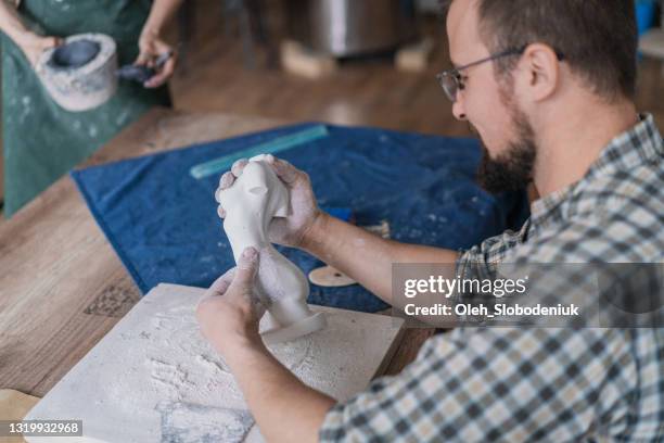 man ceramist working in studio - sculpted body stock pictures, royalty-free photos & images