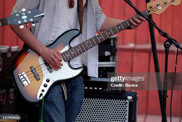 live music band concert - bass guitarist stock pictures, royalty-free photos & images