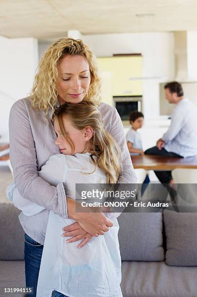 mother hugging her daughter and smiling - 8 stock pictures, royalty-free photos & images