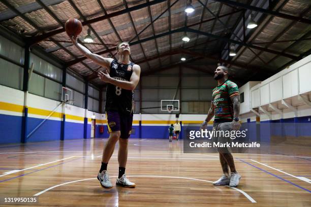Brad Newley of the Kings talks to Adam Reynolds of the Rabbitohs during a joint media opportunity with the Sydney Kings and South Sydney Rabbitohs at...