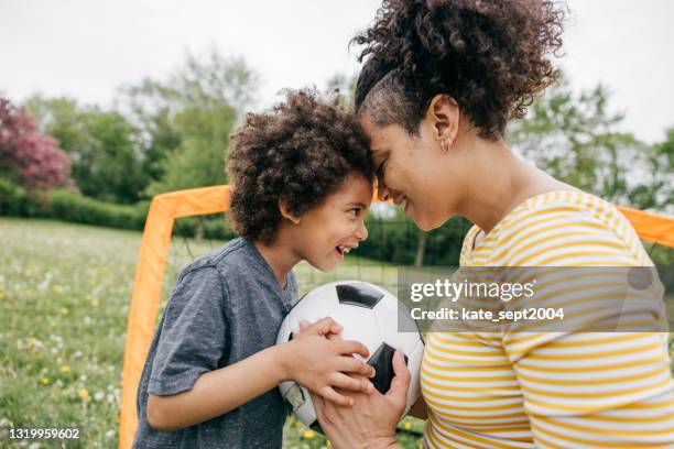 summertime activities for kids and parents - soccer game - mother of all balls stock pictures, royalty-free photos & images