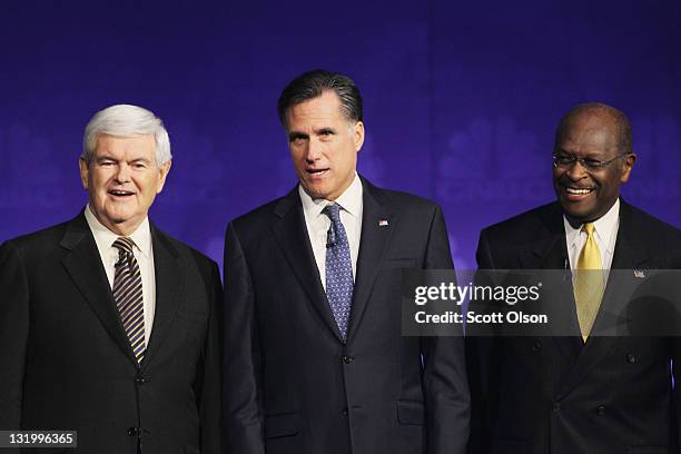 Former speaker of the house Newt Gingrich, former massachusetts Gov. Mitt Romney and former ceo of godfather's pizza Herman Cain look on prior to a...