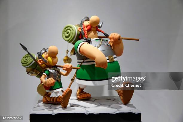 Figurines of characters of Asterix and Obelix by French designer Uderzo are on display at the "Uderzo, Comme Une Potion Magique" exhibition at the...