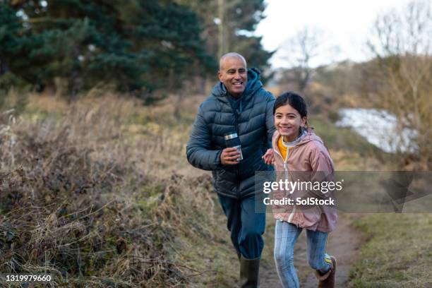 keep up dad! - family running stock pictures, royalty-free photos & images