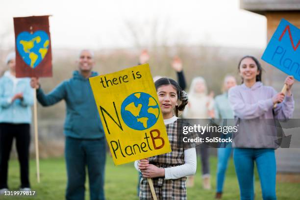 chanting for environmental issues - climate change children stock pictures, royalty-free photos & images