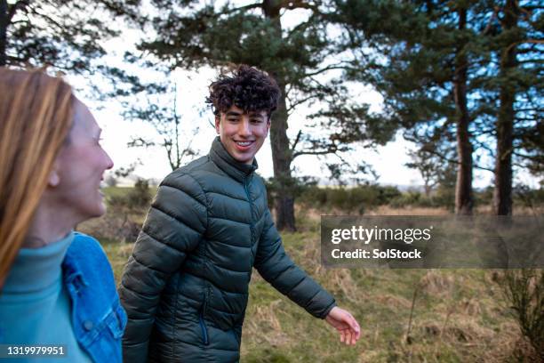 out with mum - family side by side stock pictures, royalty-free photos & images