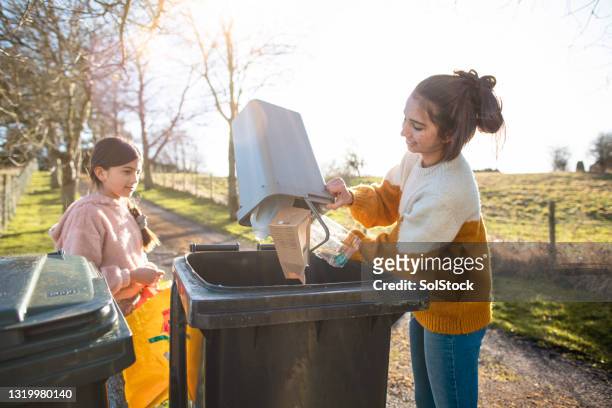 caring about the environment - mixed recycling bin stock pictures, royalty-free photos & images