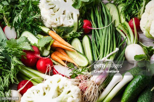 fresh colofrul vegetables, springtime harvest still life, local farmer produce - arm made of vegetables stockfoto's en -beelden