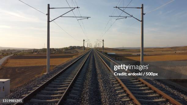 high angle view of railroad tracks against sky during sunset,turkey - tramway stockfoto's en -beelden