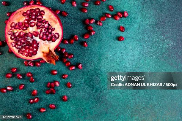 high angle view of pomegranate on table,united states,usa - pomegranate stock pictures, royalty-free photos & images