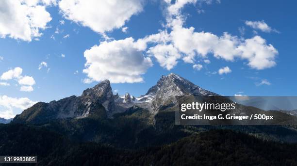 low angle view of mountain against sky,watzmann,germany - watzmann fotografías e imágenes de stock