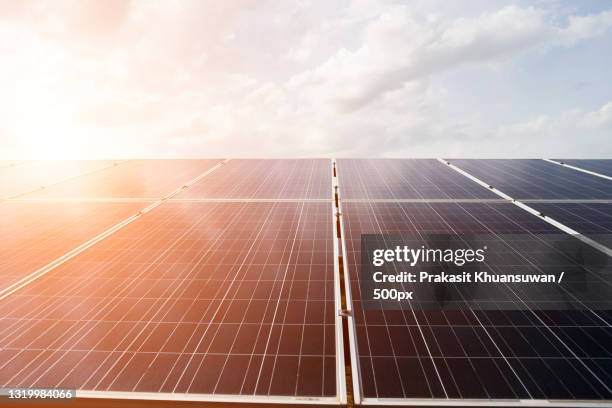 low angle view of solar panels against sky - low voltage panel stock pictures, royalty-free photos & images