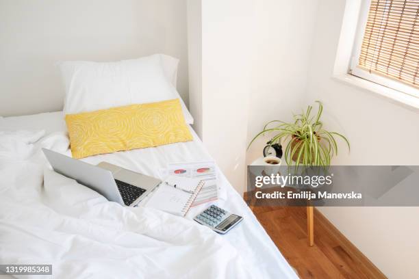 home office. laptop computer on bed - dorm room stock pictures, royalty-free photos & images
