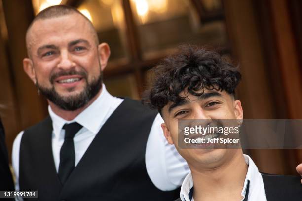 Robin Windsor and Karim Zeroual pose during the "Here Come The Boys" photocall at London Palladium on May 25, 2021 in London, England.