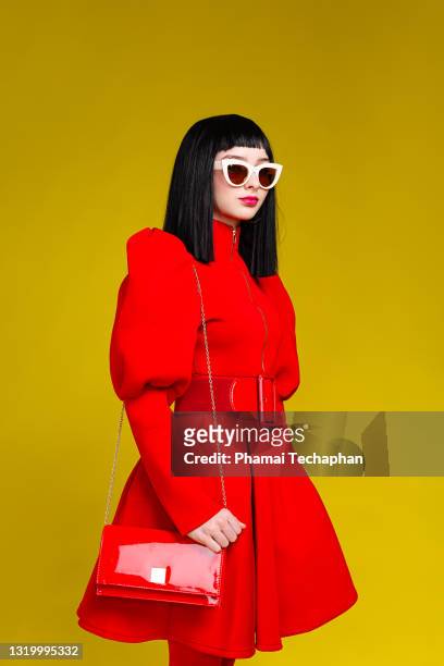girl in red dress - red sunglasses stock pictures, royalty-free photos & images