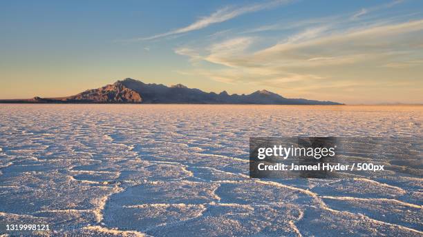scenic view of snowcapped mountains against sky during sunset,bonneville salt flats,utah,united states,usa - bonneville salt flats imagens e fotografias de stock