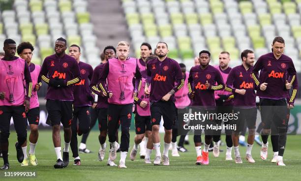 Players of Manchester United warm up during the Manchester United Training Session ahead of the UEFA Europa League Final between Villarreal CF and...
