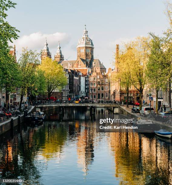 an elevated view of amsterdam at sunset - stock photo - amsterdam business stock pictures, royalty-free photos & images