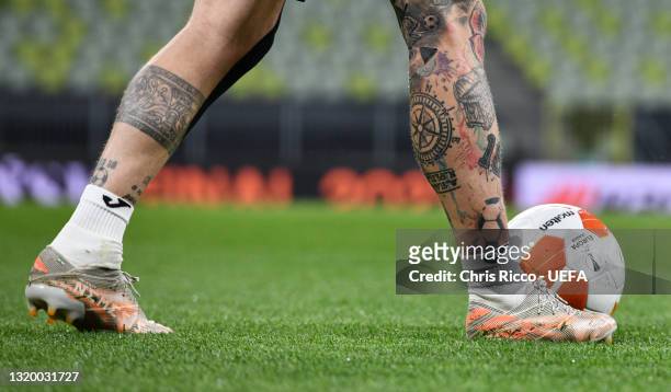 Tattoo is seen on the leg of Alberto Moreno of Villarreal CF during the Villarreal CF Training Session ahead of the UEFA Europa League Final between...
