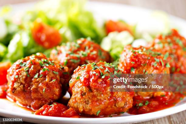 close-up of food in plate on table - meatballs foto e immagini stock