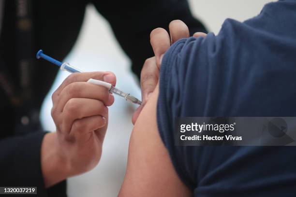 Citizen receives a dose of the vaccine for COVID-19 during a vaccination day as part of the campaign in Mexico City at Escuela Nacional Preparatoria...