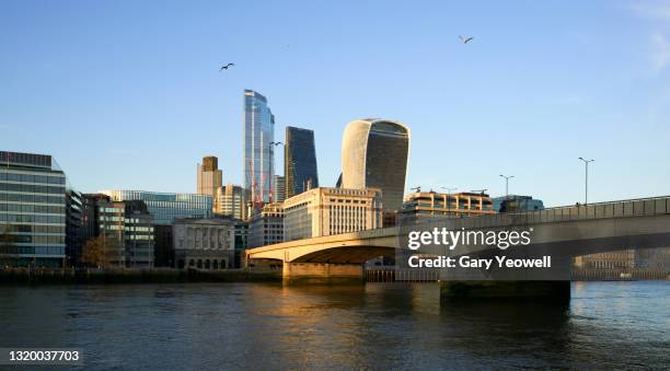 london financial district city skyline at sunset - london bridge stock pictures, royalty-free photos & images