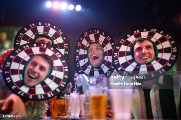 Spectators socialise in the Marshall Arena during night 14 of the 2021 Unibet Premier League darts tournament on May 25, 2021 in Milton Keynes,...