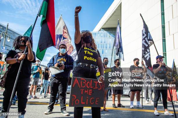 Black Lives Matter supporters take to the streets in Los Angeles outside LAPD Headquarters during the first anniversary of George Floyd"u2019s death...