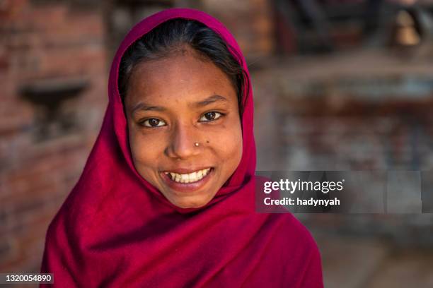 portrait of happy young nepali girl in bhaktapur, nepal - nepal girl stock pictures, royalty-free photos & images
