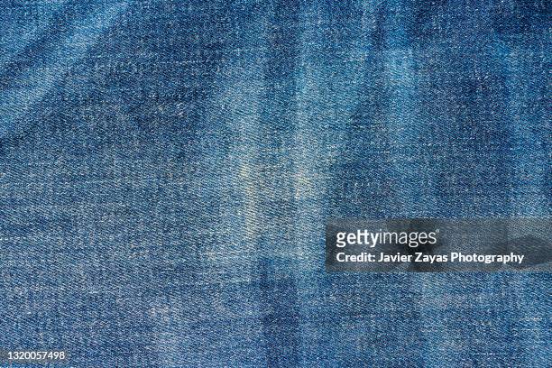 blue jeans denim pattern texture - vaquero fotografías e imágenes de stock