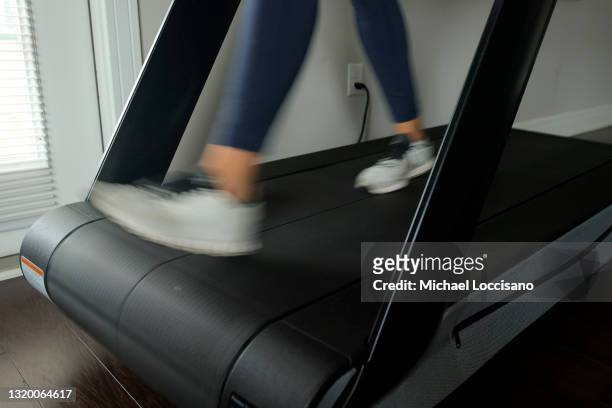 Liza Lecher works out on her Peloton Tread+ treadmill on May 24, 2021 in Williamstown, New Jersey. Earlier this month, Peloton recalled its Tread and...