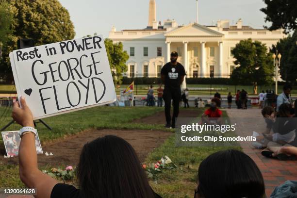 Small group of people gather for a vigil on the one-year anniversary of George Floyd's murder in Lafayette Square near the White House on May 25,...