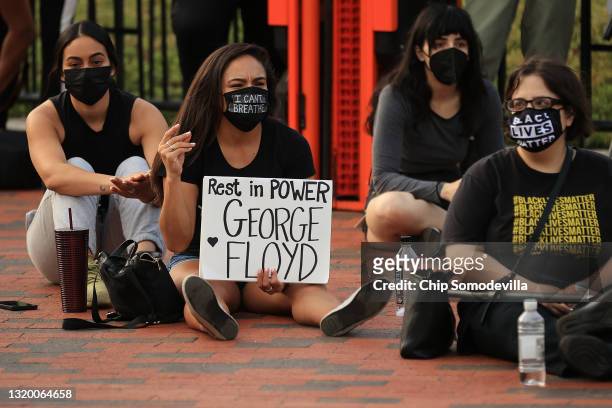 People gather for a vigil on the one-year anniversary of George Floyd's murder in Lafayette Square near the White House on May 25, 2021 in...