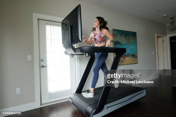 Liza Lecher works out on her Peloton Tread+ treadmill on May 24, 2021 in Williamstown, New Jersey. Earlier this month, Peloton recalled its Tread and...