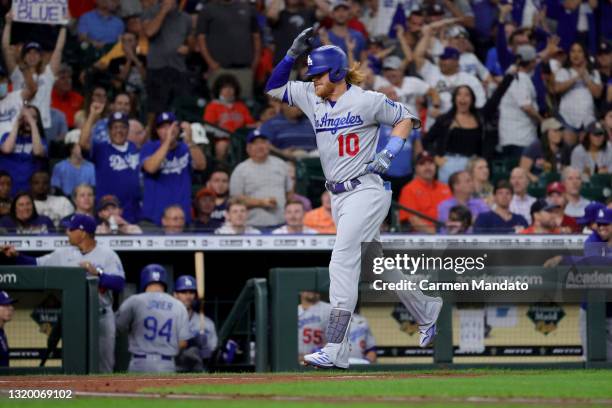 Justin Turner of the Los Angeles Dodgers celebrates after hitting a two run home run during the fourth inning against the Houston Astros at Minute...