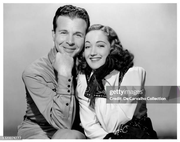 Actor Dick Powell as ‘Steve Baird’ and Actress Dorothy Lamour as ‘Ann Castle’ in a publicity shot from the movie 'Riding High' United States.