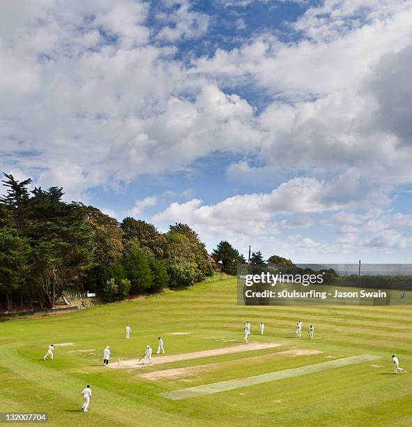 cricketers playing on ground - england cricket team stock pictures, royalty-free photos & images
