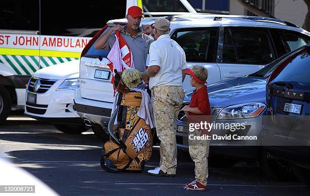 John Daly of the USA prepares to leave the course in a courtesy car after walking off the course in a rage at the 11th hole during day one of the...