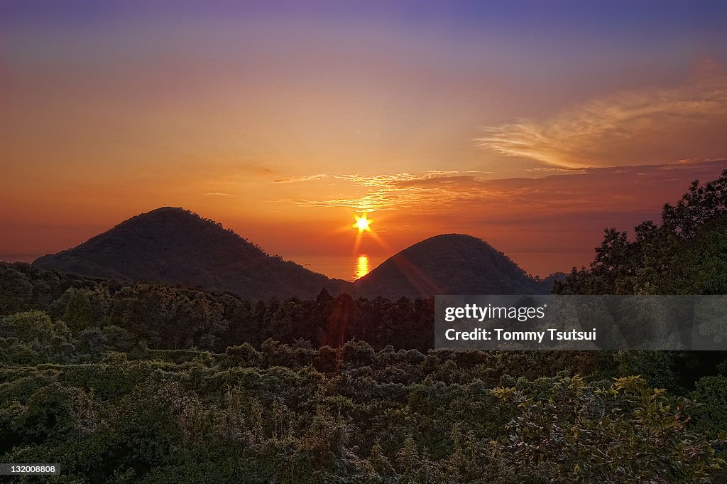 Sunset between two hills