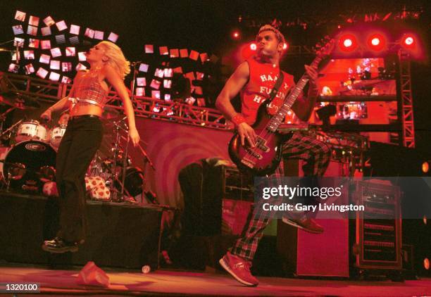 Singer Gwen Stefani, left, and basist Tony Kanal perform live with their band No Doubt December 17, 2000 at K-ROQ''s Almost Acoustic Christmas...