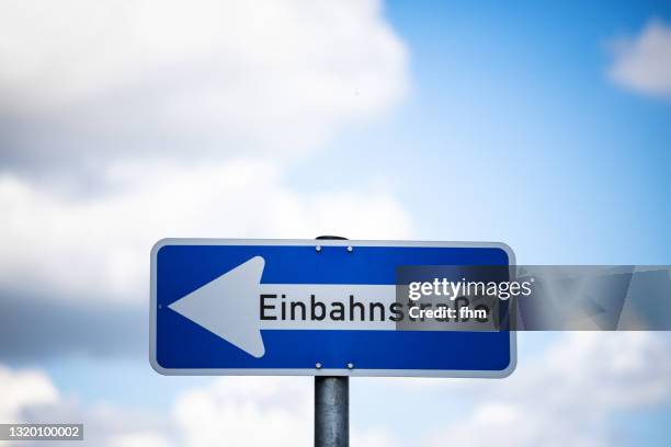 street sign "one way street" (einbahnstrasse) - no choice stock pictures, royalty-free photos & images