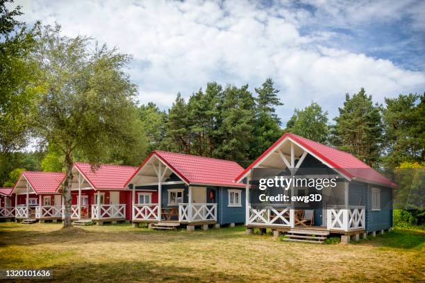 holiday in poland - colorful, swedish style cabin houses in a summer day - bungalow stock pictures, royalty-free photos & images