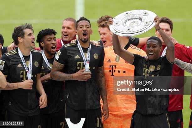 Jerome Boateng of Bayern Muenchen and David ALABA of Bayern Muenchen and Javi Javier Martinez of Bayern Muenchen lift the Bundesliga Meisterschale...