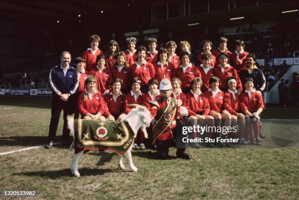 The victorious USA team pictured with the Welsh Guards Goat mascot before the final of the inaugural Women's Rugby World Cup Final between the USA...