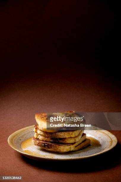 stockpile of french toasts on ceramic plate - french culture stock pictures, royalty-free photos & images