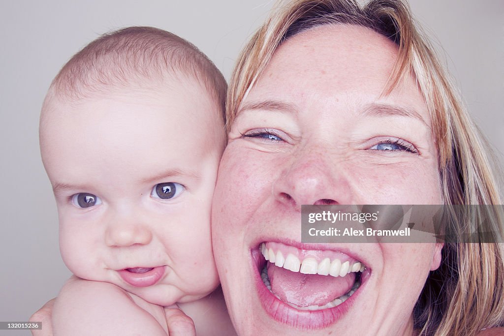 Close up of happy woman with baby boy