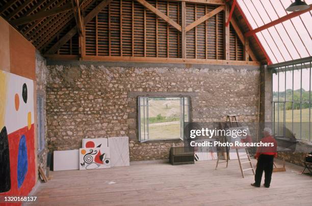 View of American artist Alexander Calder as he paints in his studio, Roxbury, Connecticut, 1973.