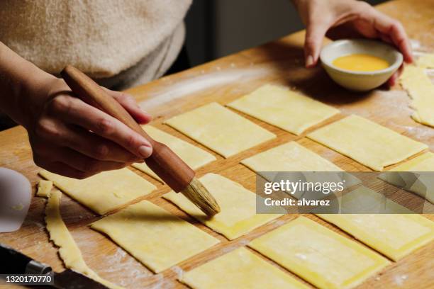 woman preparing toaster pastry - butter tart stock pictures, royalty-free photos & images