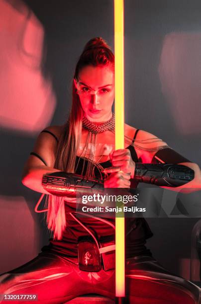 female space warrior - laser sword stock pictures, royalty-free photos & images