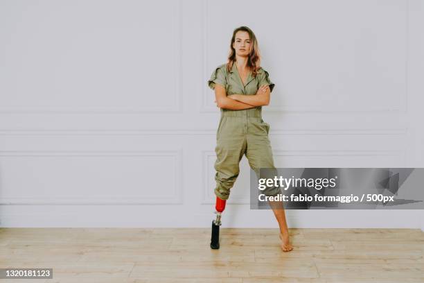 beautiful woman with prosthesis leg - editorial woman stock pictures, royalty-free photos & images